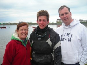 Welcomed ashore by his parents