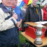 Coxswain Dr.Eoghan Lavelle presents Malahide u17 crew 1st place with Woodlatimer(Dick Vekins Memorial tropy)