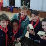 Cub leader Caroline O'Brien with cubs who had finished their bird feeders