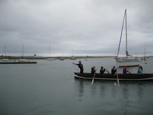 Bow person casting lead line to record depth