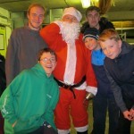 Santa meets scouts selling his trees at the den